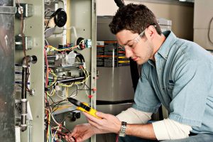 Service technician testing a furnace.