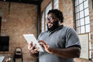 happy-man-using-tablet